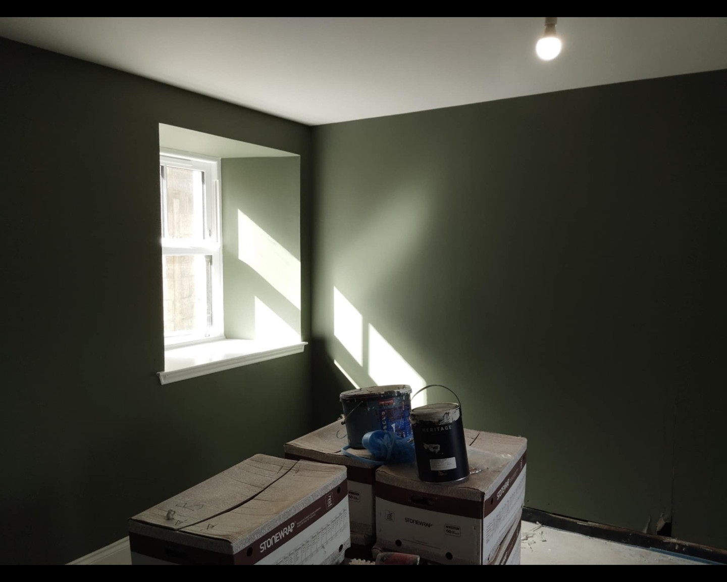 Job B after: window wall painted dark green