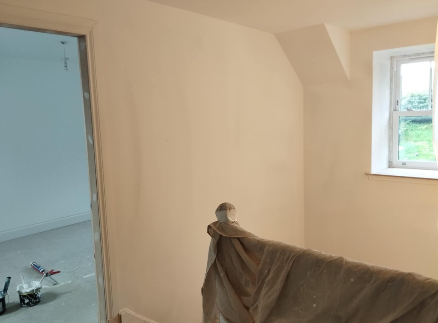 Job C view 1 before: plain plaster landing with dust sheets