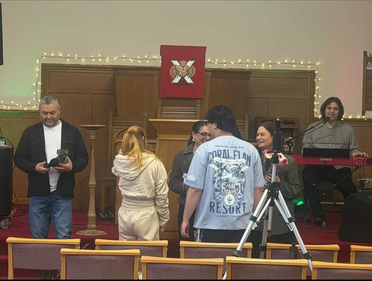 Team setting up cameras and equipment before a church service