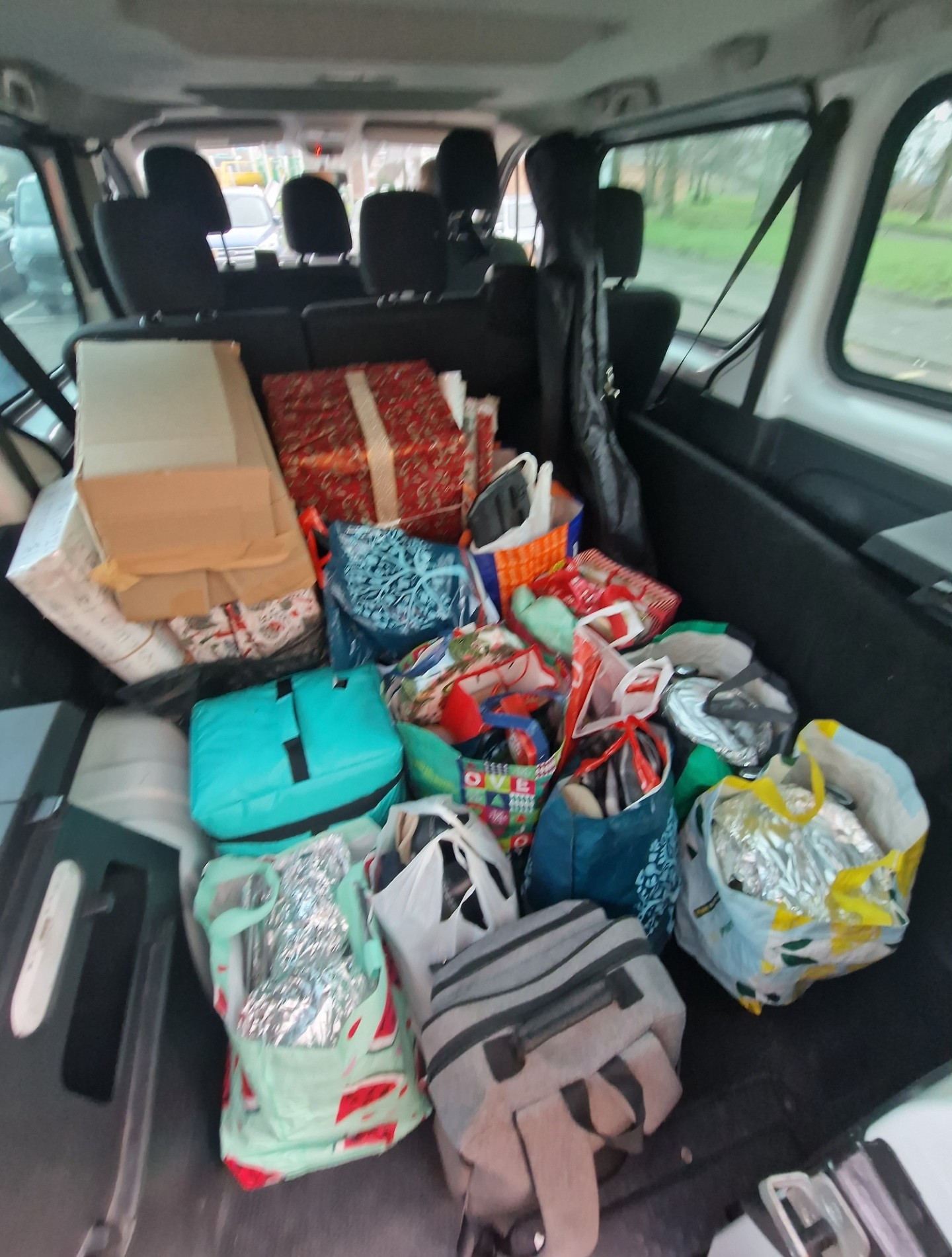 Van boot full of food and wrapped presents