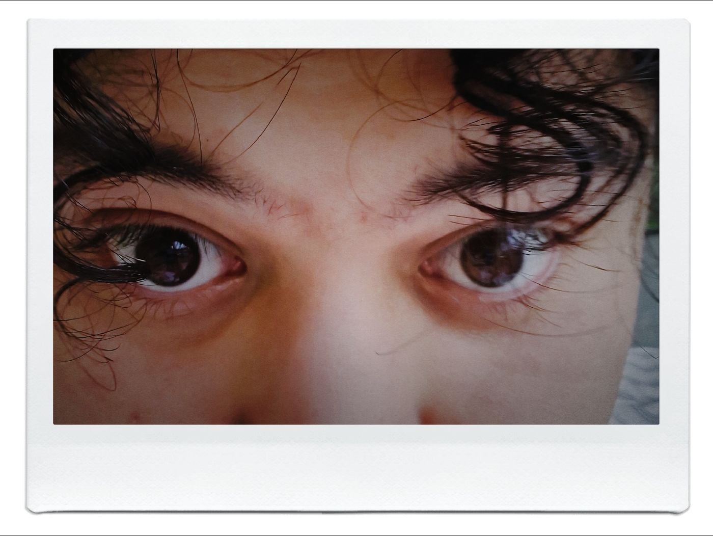 Instant photo close-up of Samuels' eyes