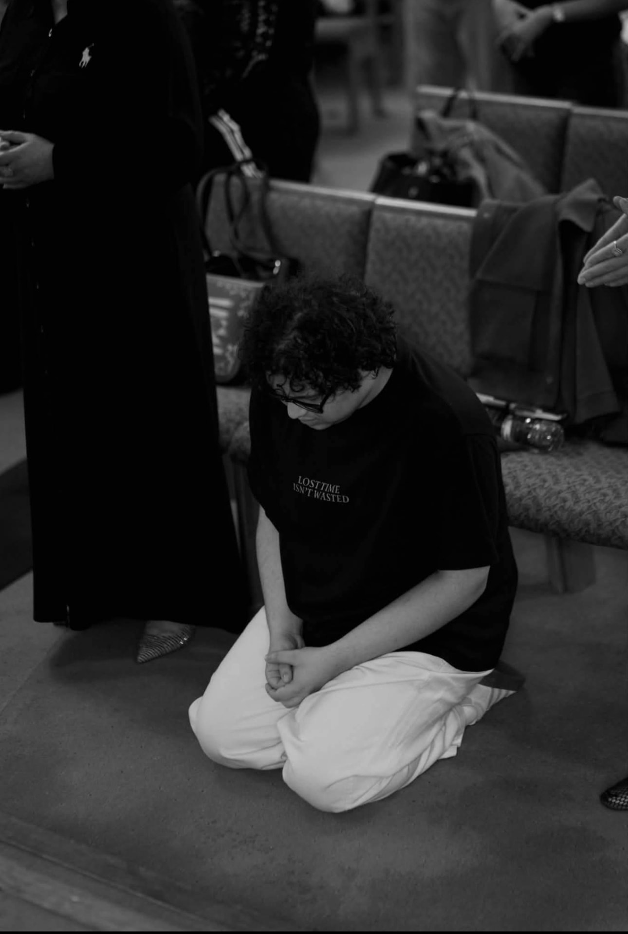 Black and white photo of Samuels kneeling