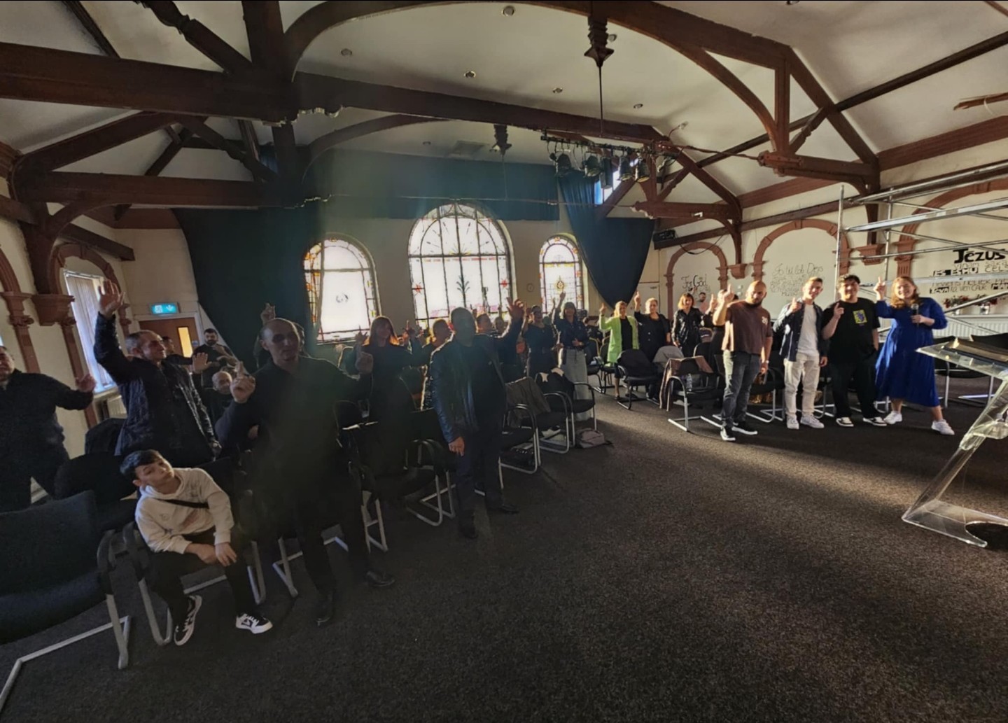 Large crowd at a conference in a church hall