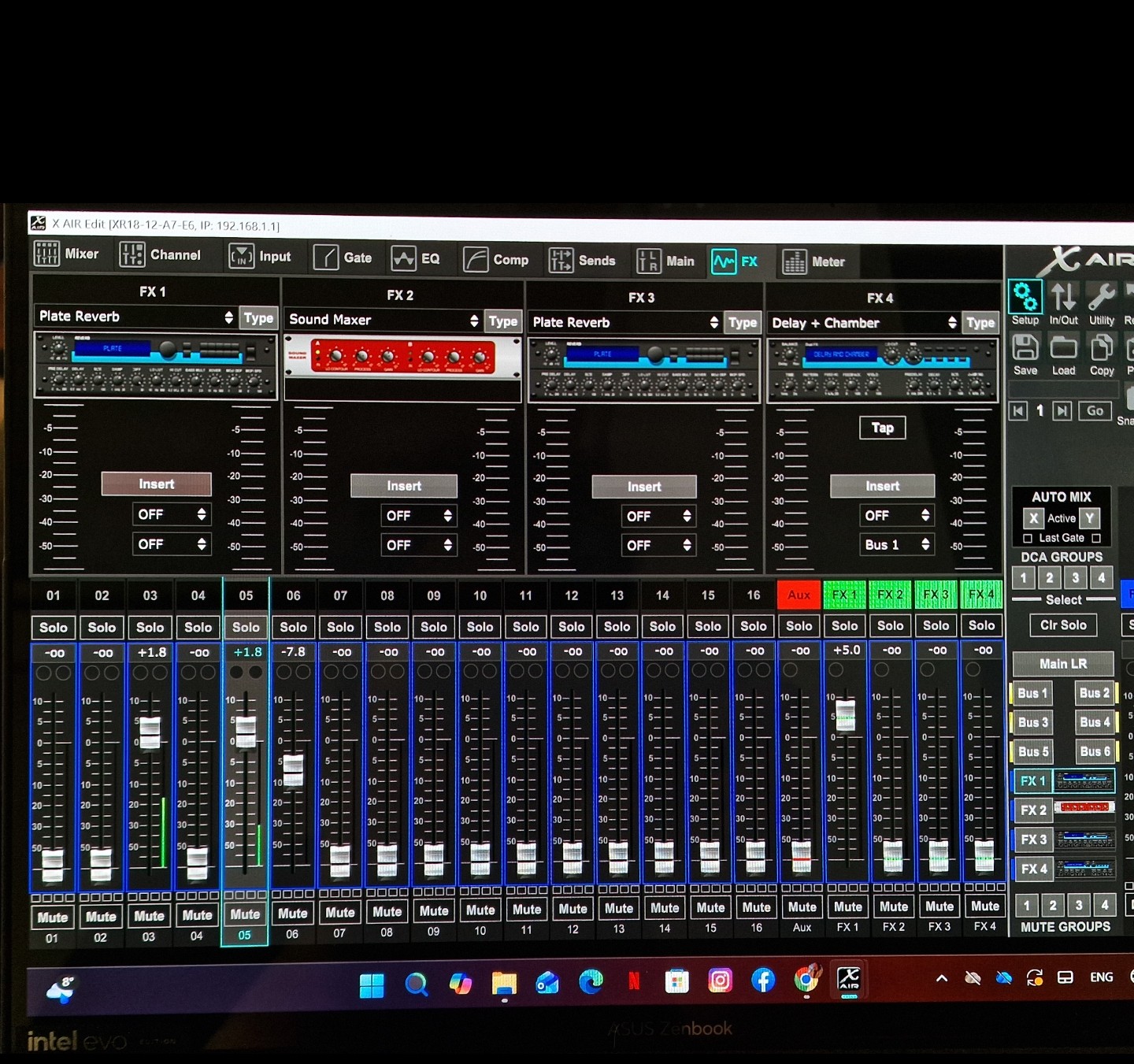 Digital mixer software on a laptop with channel faders and effects